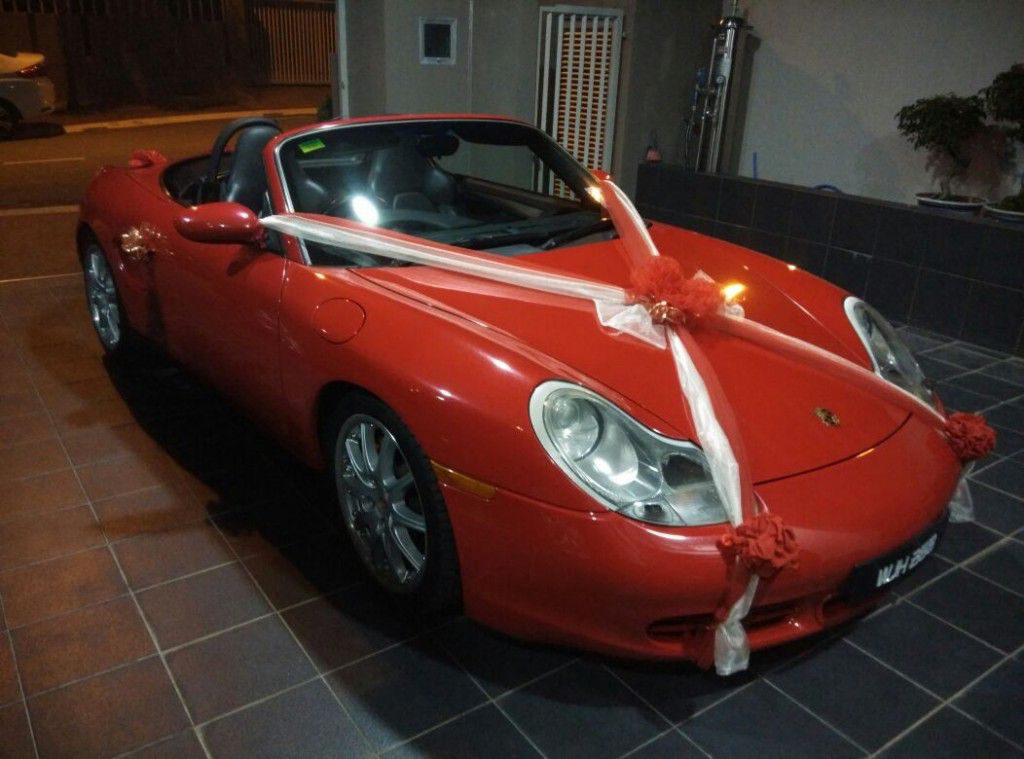 red wedding car porsche front