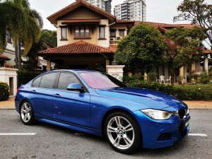 BMW M Sport in front of house