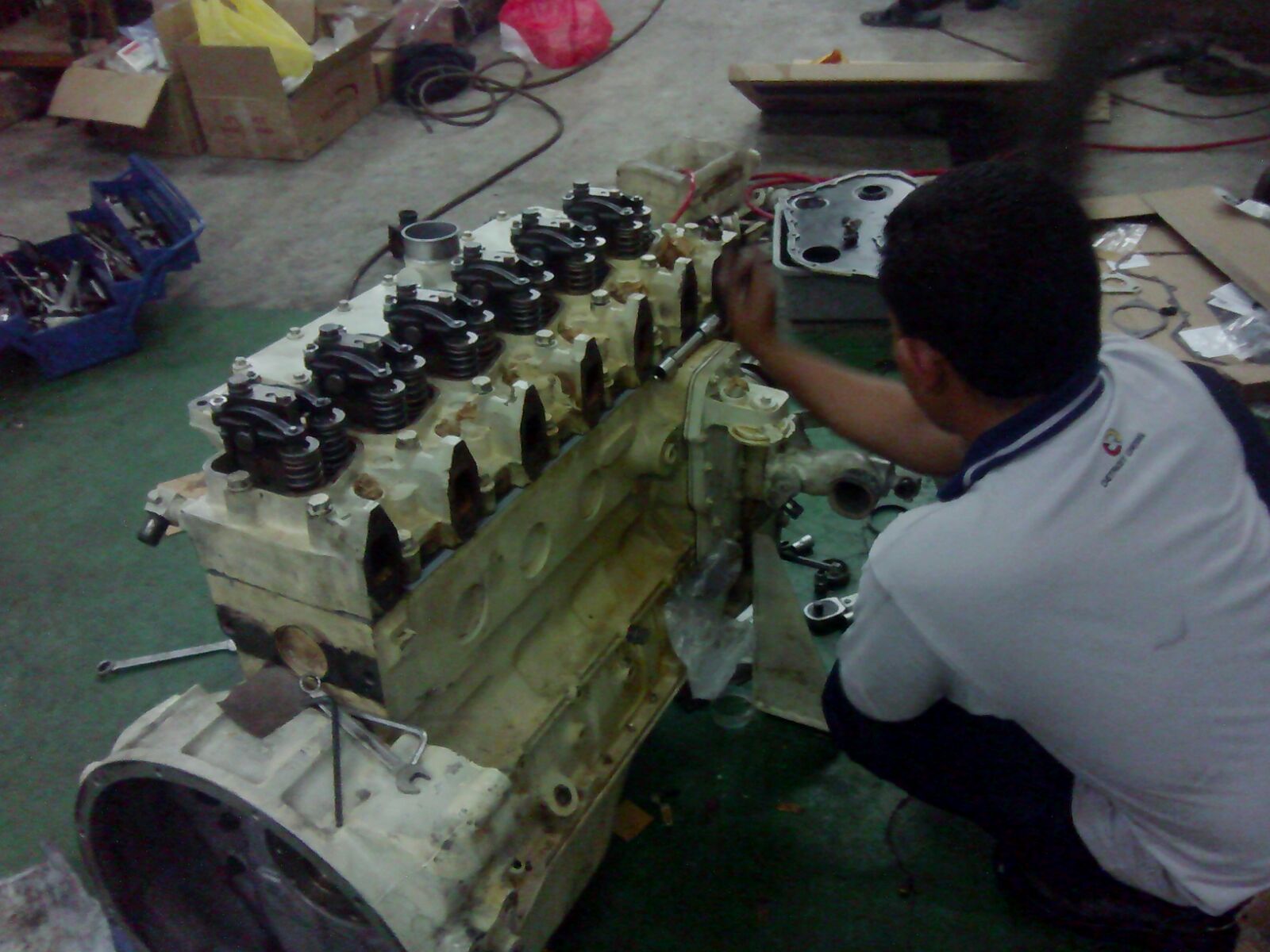 Mechanic repairing engine